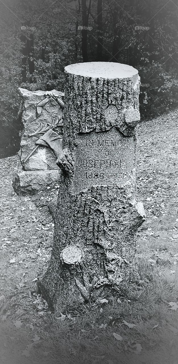 In memory of...incredible stonework on this headstone. 