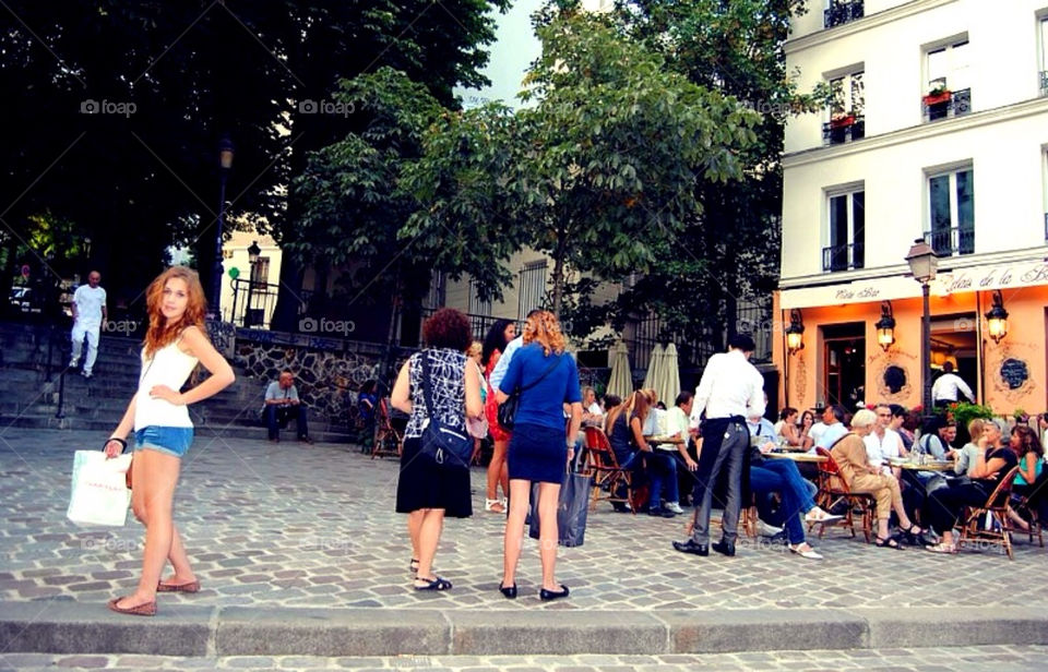 Girl in Paris. Girl standing outside a restaurant in Montmartre in Paris 
