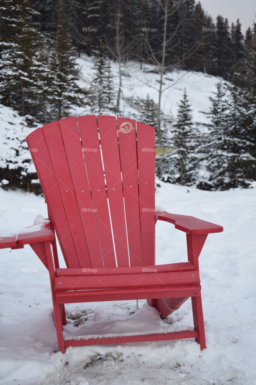 Red Chair on Snowy Lake