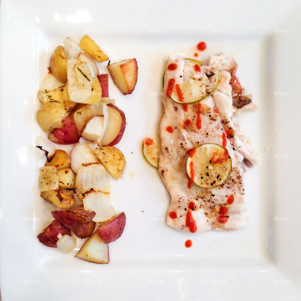 Fish and potatoes. Roasted rosemary potatoes with lime-sriracha fish. 