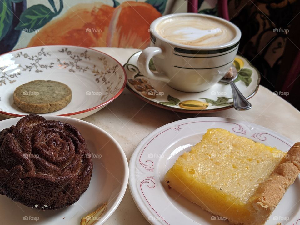 coffee and pastries in cute plates