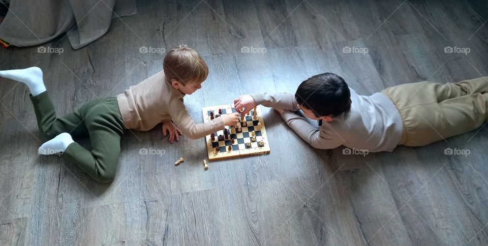 two boys playing chess