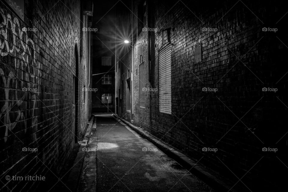 Sutherland Lane in Sydney’s Chippendale. The acrid smell of bygone days and cutthroat razors hangs in the moist air of spring showers - I look behind me as a breeze grazes my neck. No, I am still alone