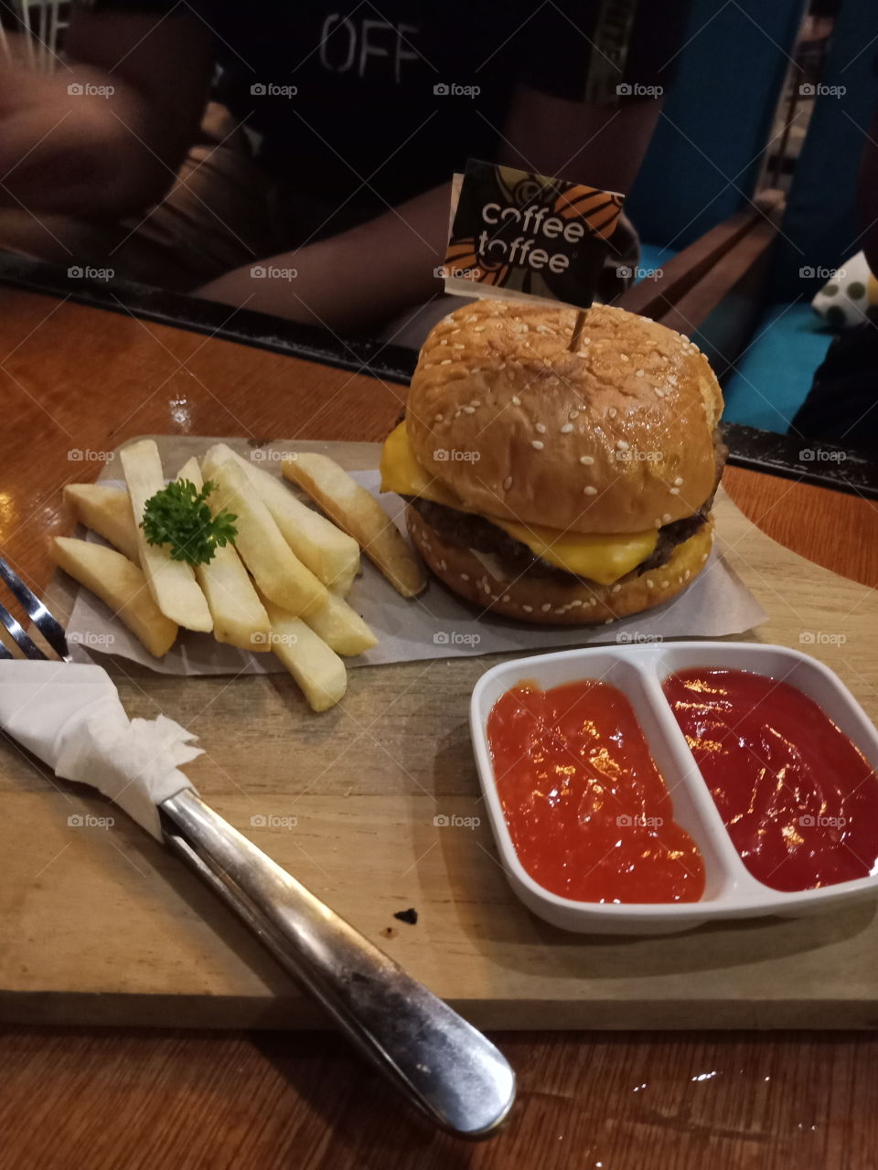 beef burger with cheese and fried potatoes