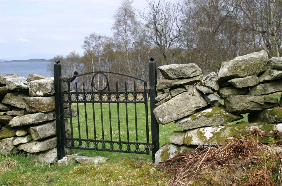 Gate in stone fence. 
