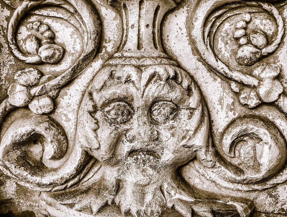 Stone relief of an usual face found at the Convent of Christ, Tomar, Portugal