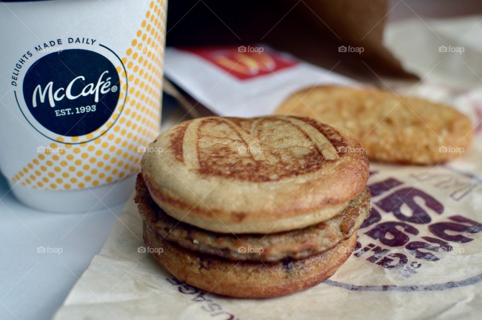 McDonald’s Mc Café sausage McGriddle hash brown close up side flat lay