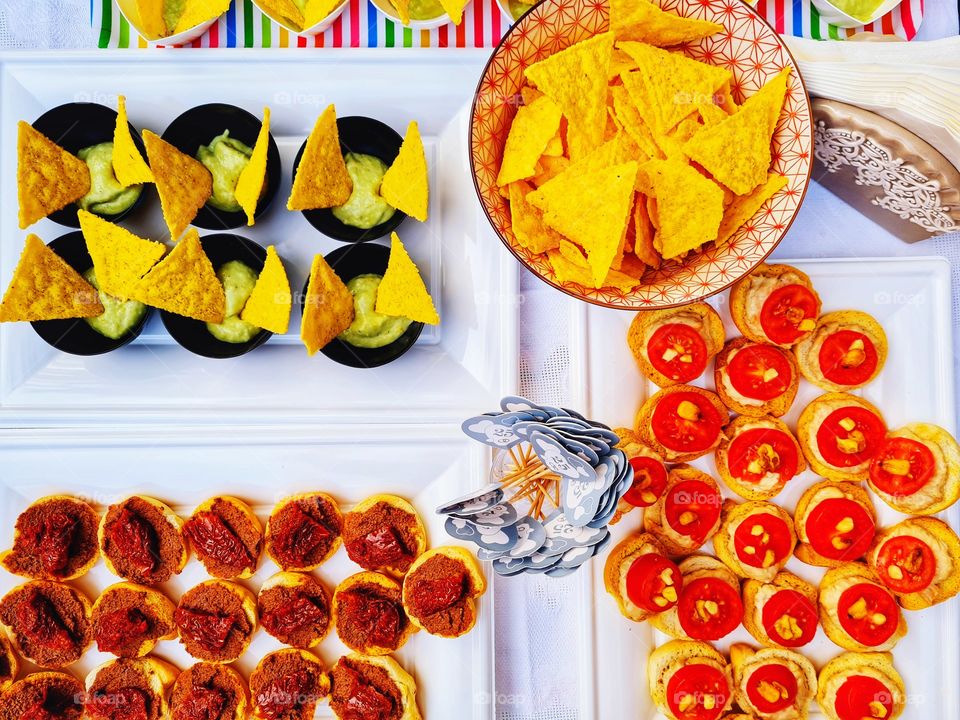 small table with snacks photographed from above