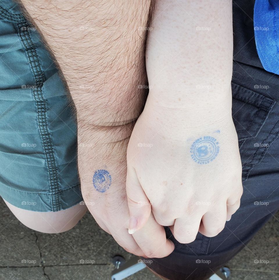 hand stamps to attend an outdoor concert at the State Fair with the person you love most