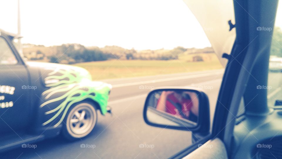 on the motorway in new zealand. a nice car beside us