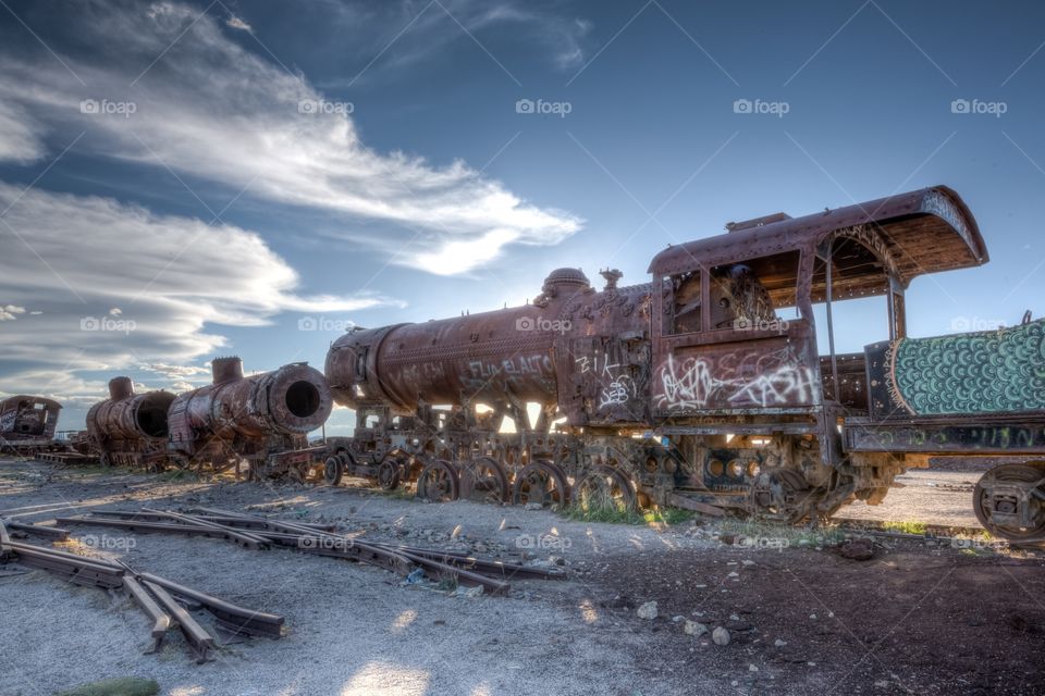 Old train during sunset. Old train in Yuni locomotive museum photographed during sunset. Sunset behind rusty train