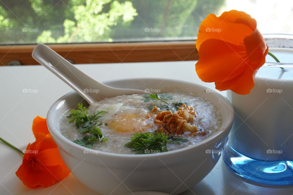 Fun breakfast rice soup sunny side up