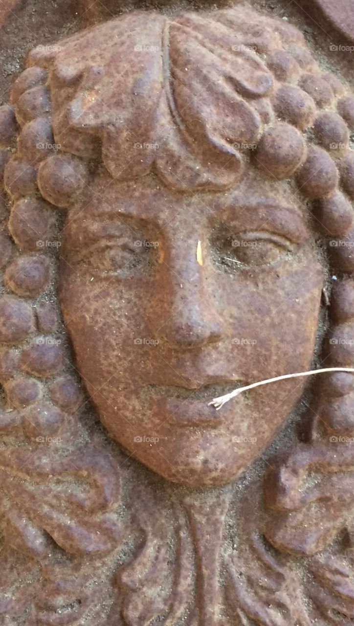 Red stone lady statue 