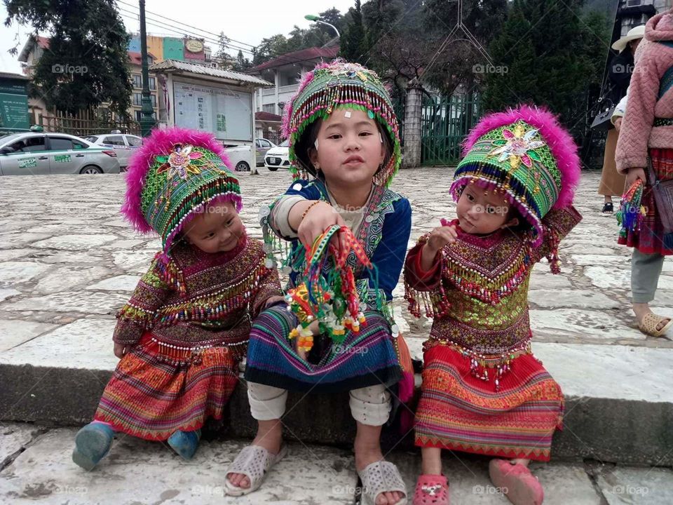 cute joyful kids in traditional clothes