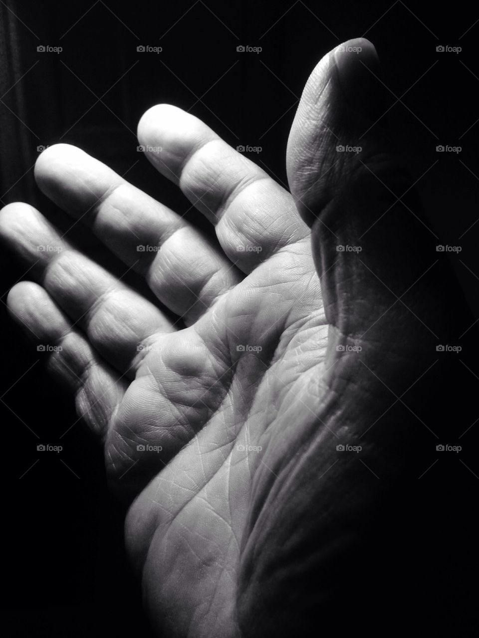 Close-up of human hand at night