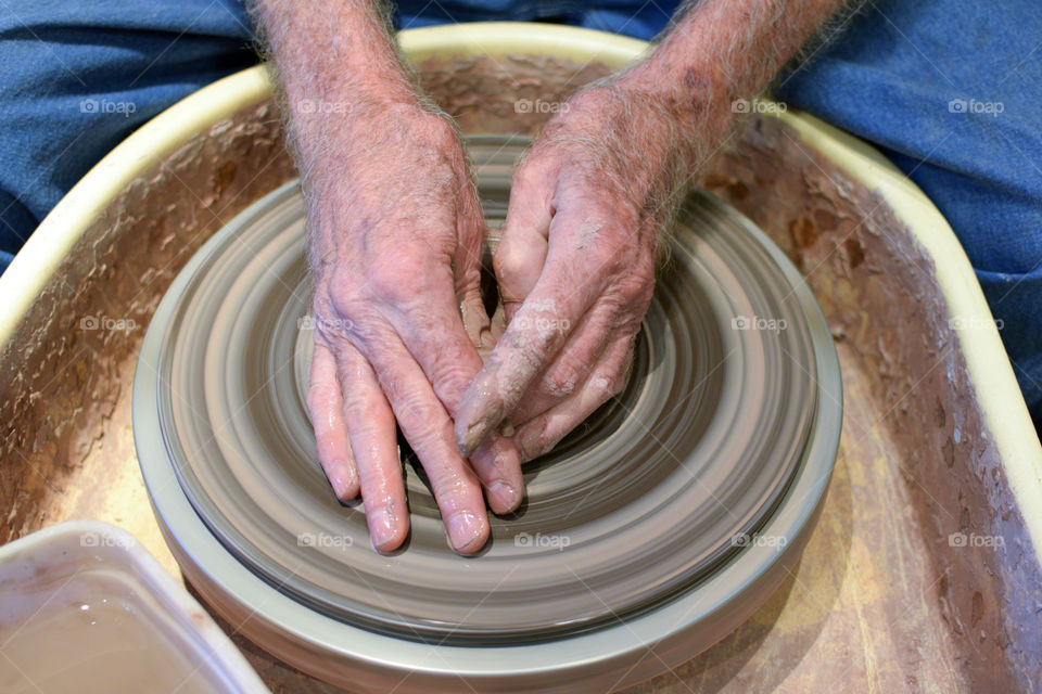 Man making pottery on a Potter’s wheel 
