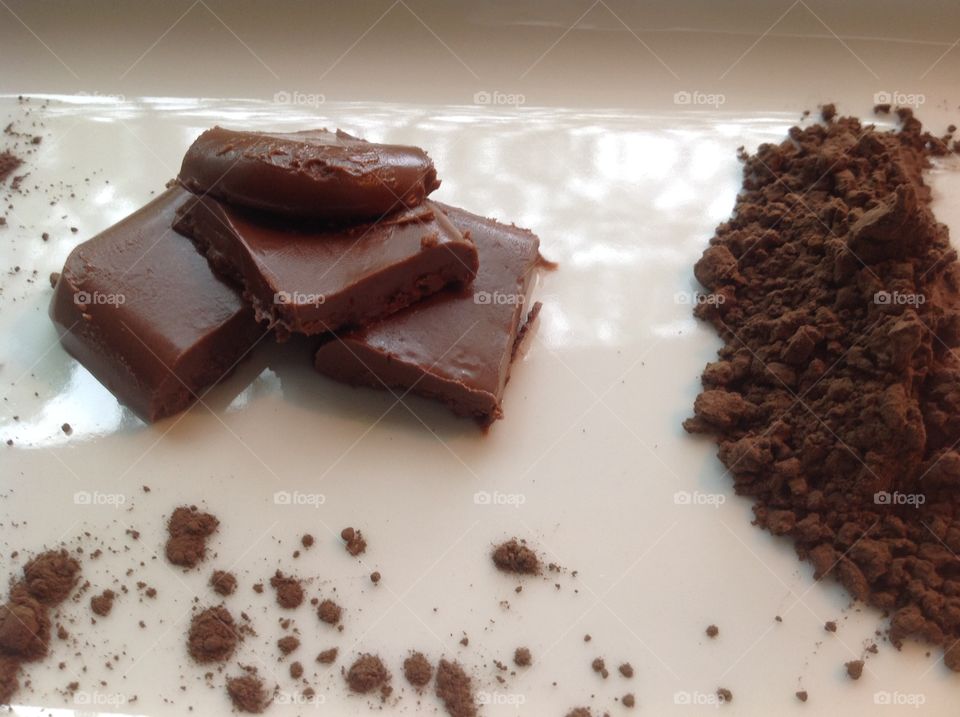 Pieces of fudge with cocoa powder.