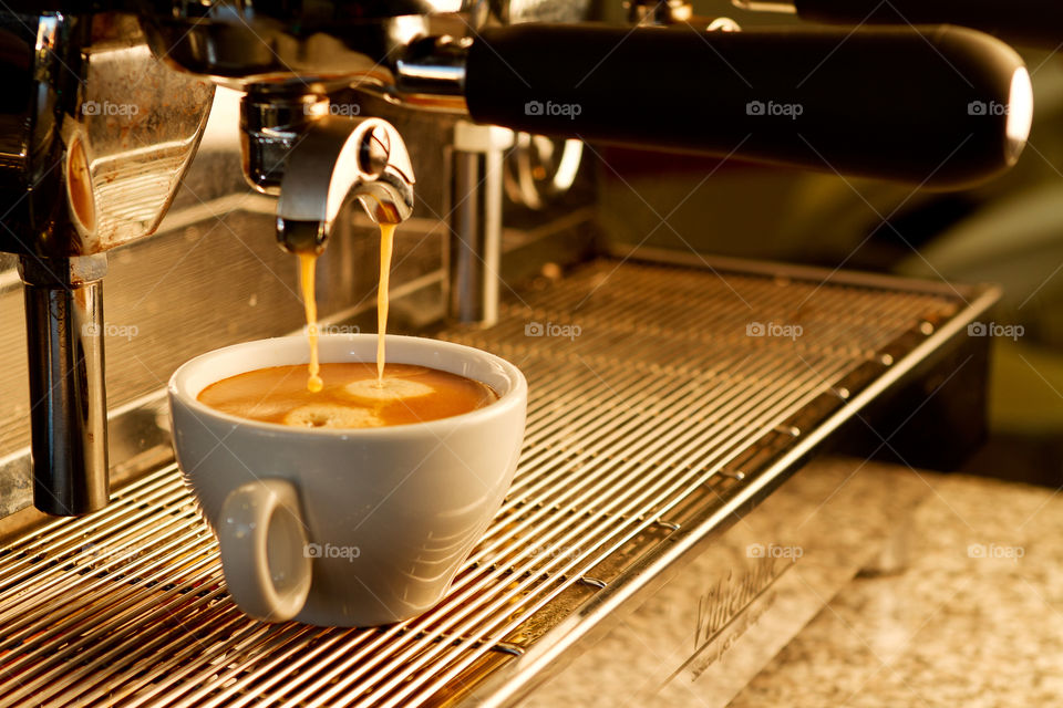 coffee being made with espresso shot