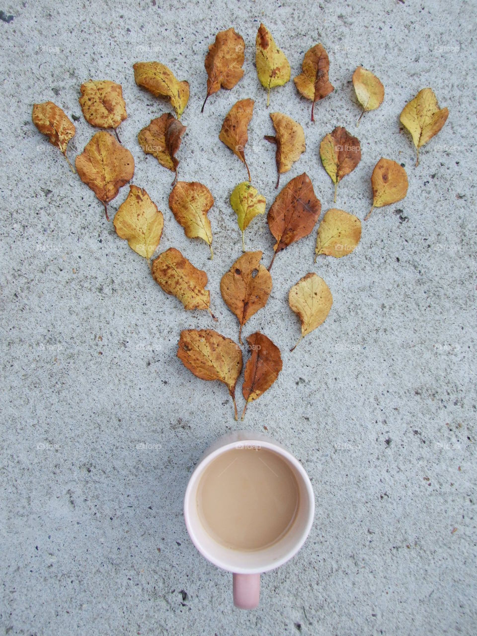 Leaf design above mug of tea
