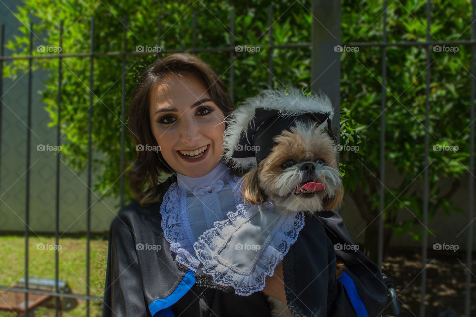 Girl graduating with her dog
