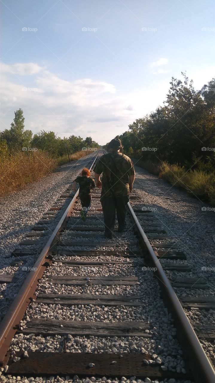 father and son on railway
