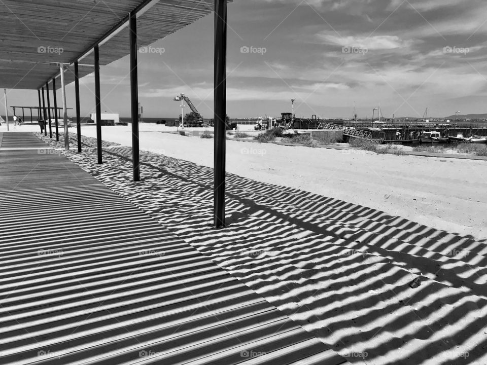 shadow of the cover of a walkway on the beach of the island of Culatra, Portugal