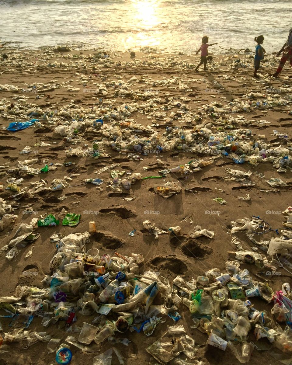Tragic site on Kuta beach in Indonesia. Tons of waste washes up on the western beaches everyday during the winter months. It seems a lot has to do with the rivers washing out coupled with a change of the winds and tides in winter, but it's still a shocking sight to see. 
