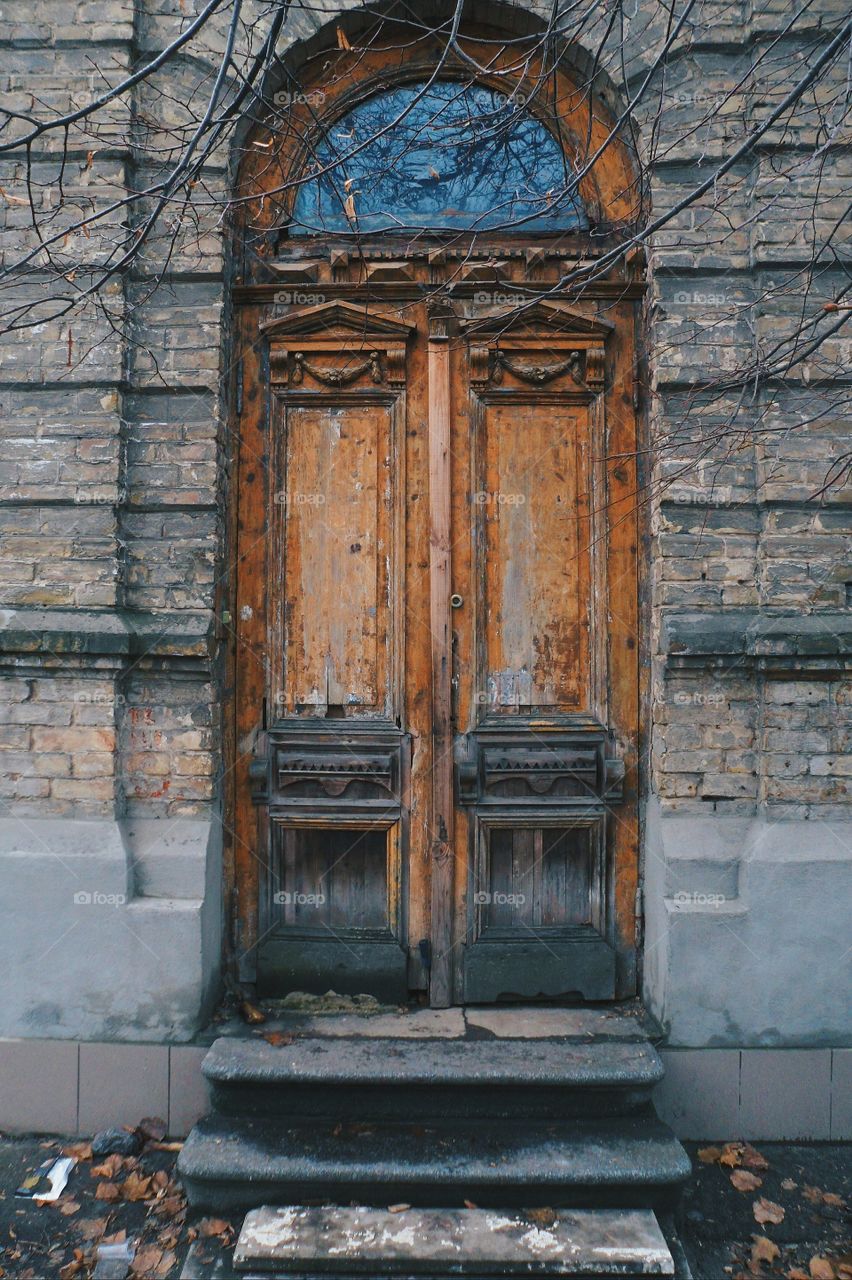 old wooden door in a brick house