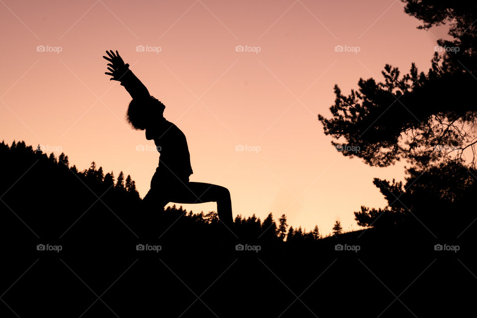 Beauty Yoga in twilight moment in front of land scape background