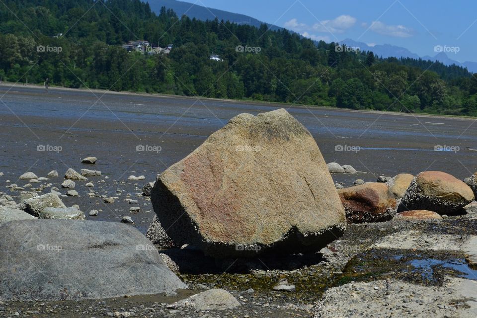 Low Tide. Low Tide, Boulder in foreground