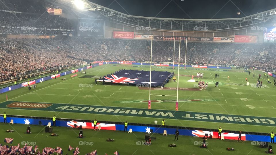 An image of Australia flag and spectators at ANZ Stadium in Sydney Australia 