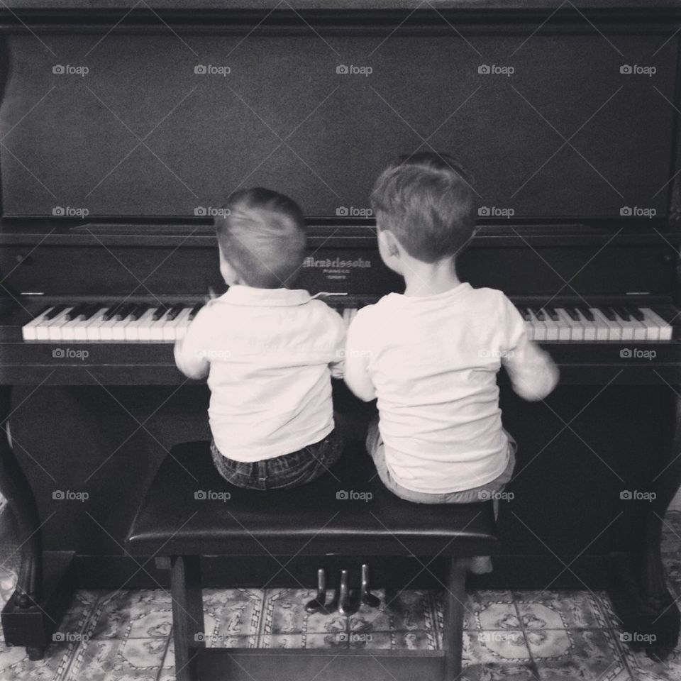 Brothers playing piano