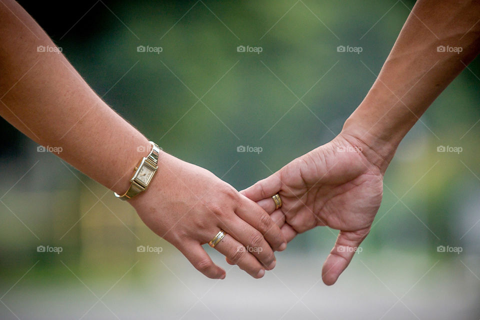 Couple holding hands outdoors