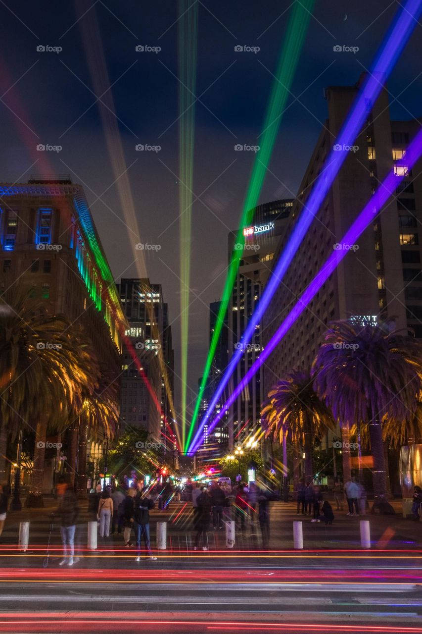 2023 San Francisco Pride light installation beaming the colors of the pride flag down market street from the ferry building on a beautiful evening