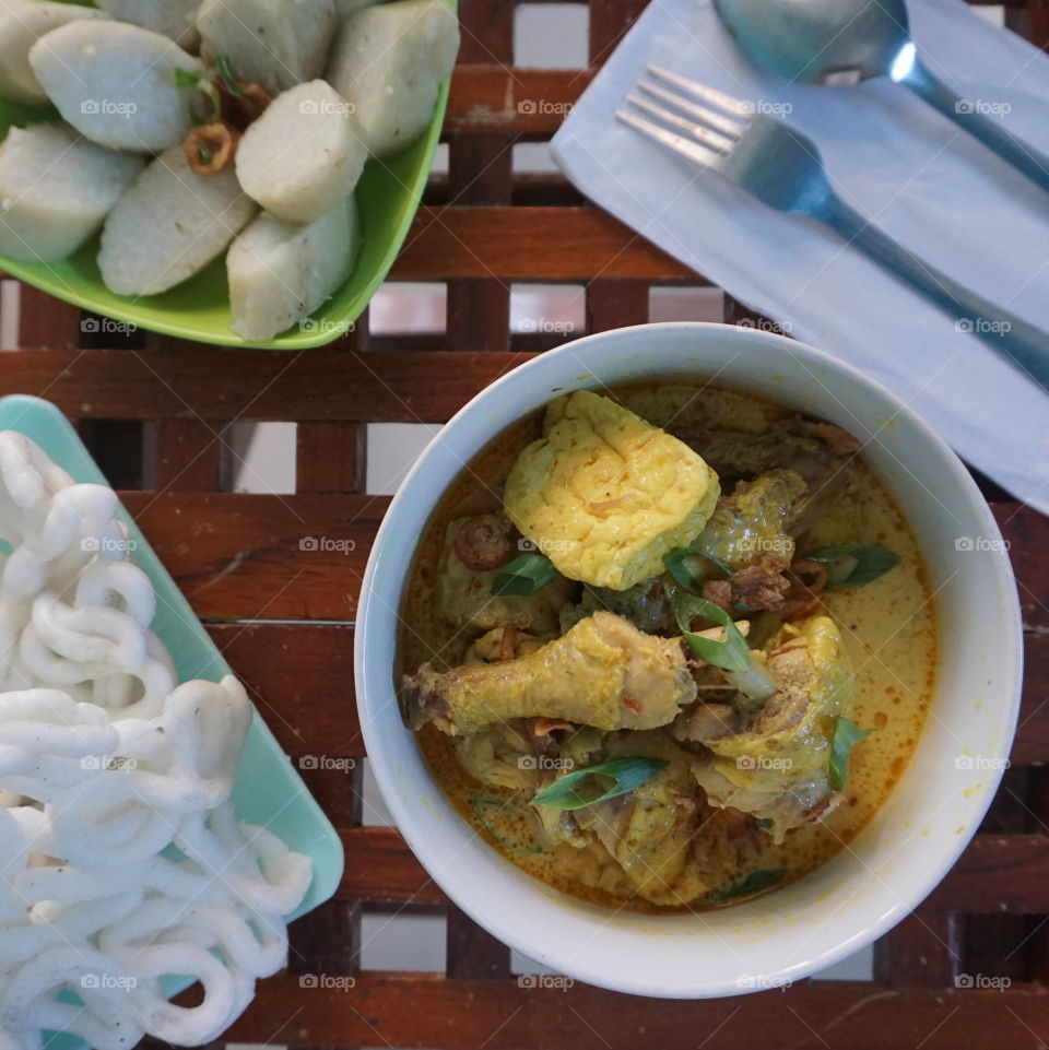A yellow chicken curry, a traditional food from Indonesia.