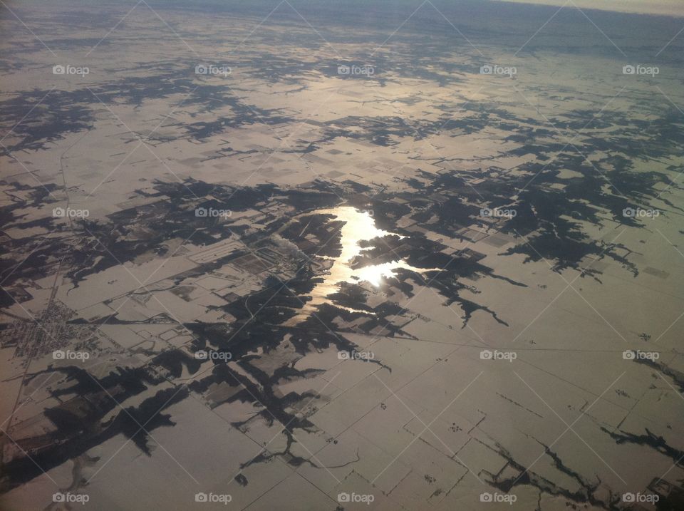 Sunshine on Lake in winter from the air