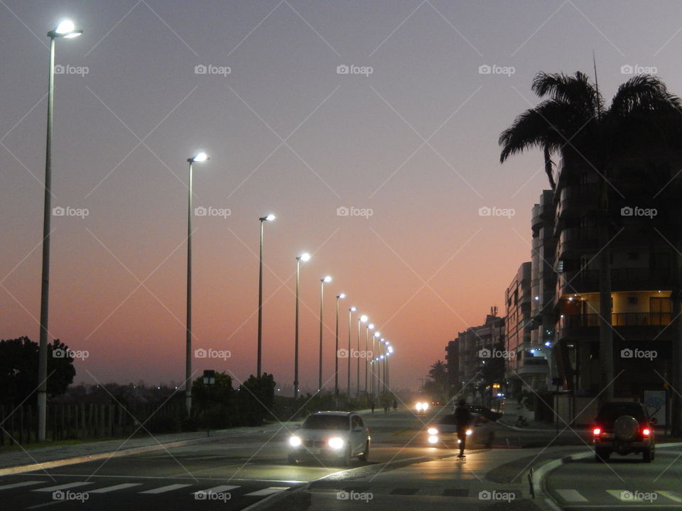 Sunrise street. Street in front of the beach at sunrise time.