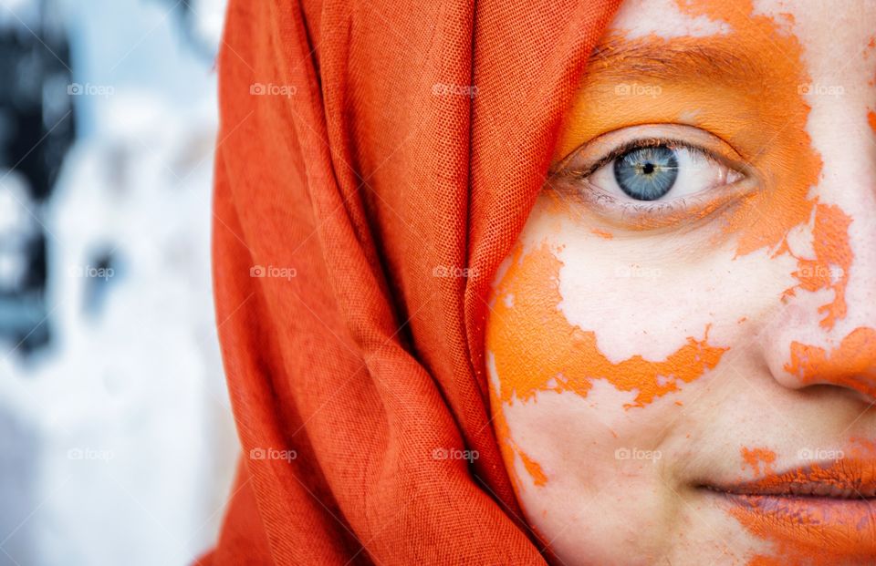blue eyes on an orange scarf