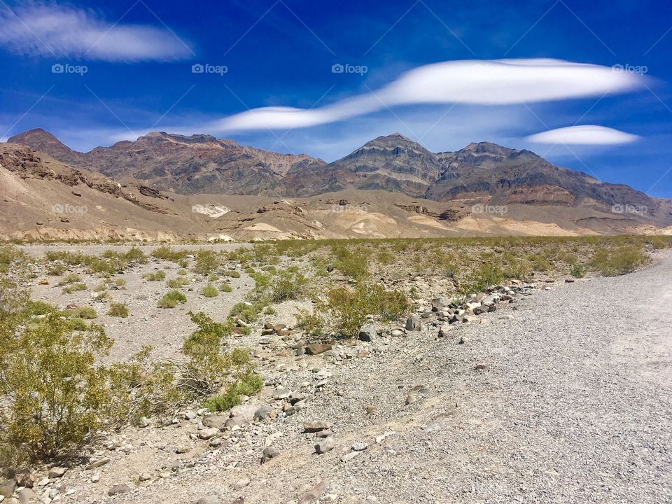A bizarre-looking group of clouds hover over a dry desert landscape in Nevada. 
