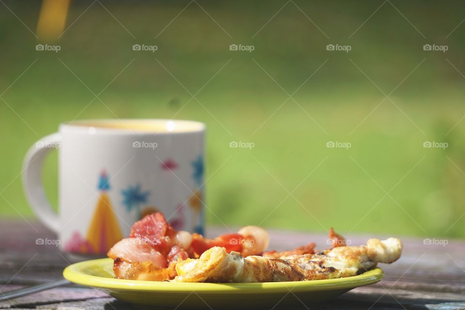 A fluffy onion and cheese omelet, bacon, and coffee! Best way to start a day!
