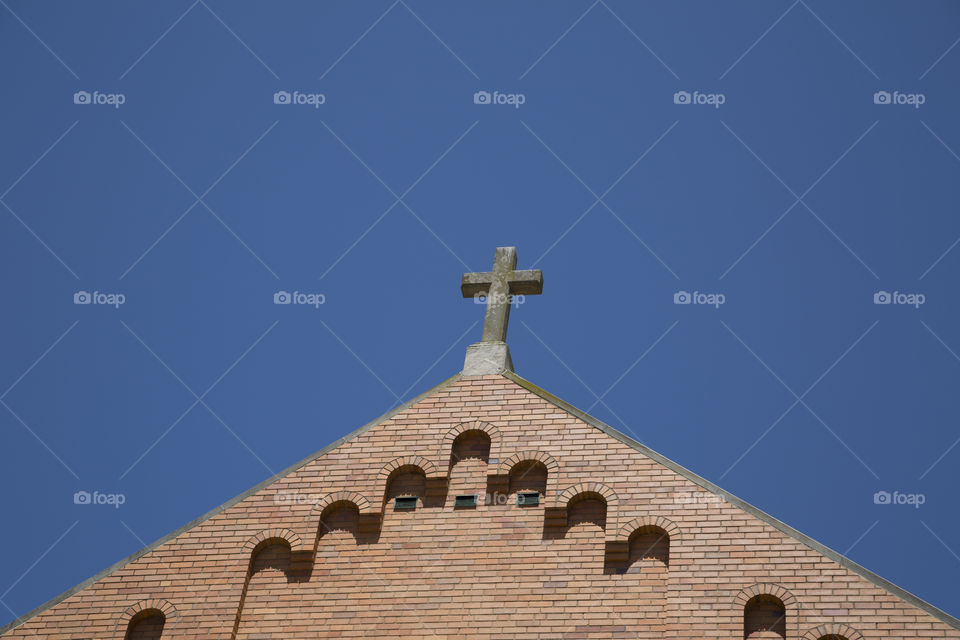 Religious Cross. A religious cross on top of a church. 