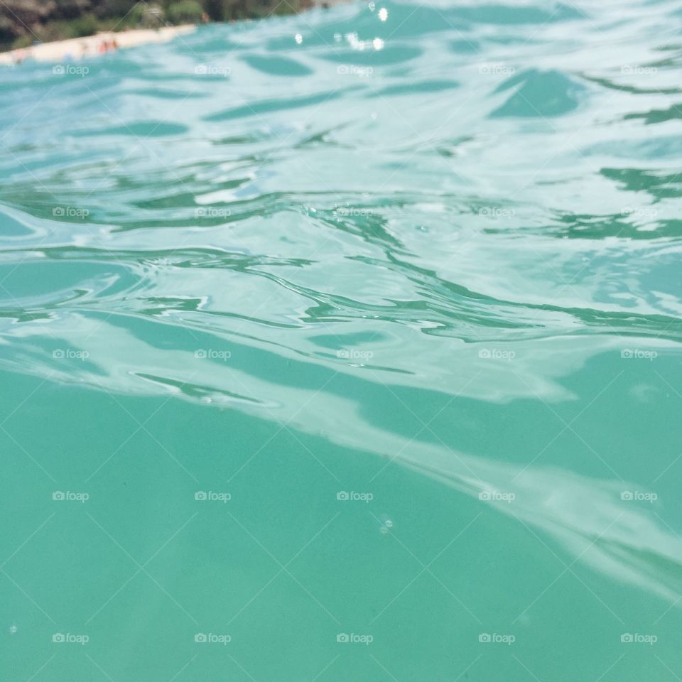 Close up of clear blue water.