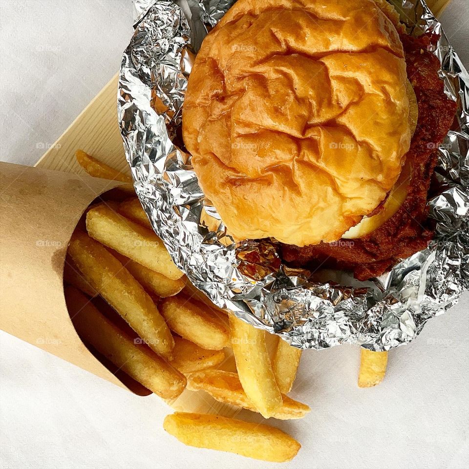 Peranankan styled chicken rendang burger with thick chunky fries 