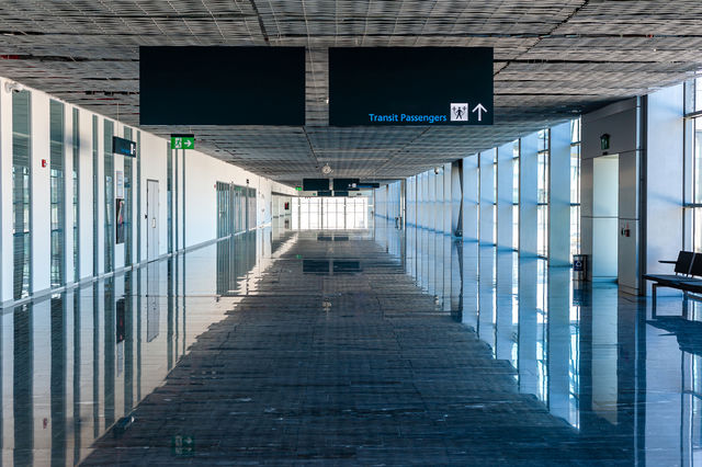 Empty passengers transit hall in airport terminal building.