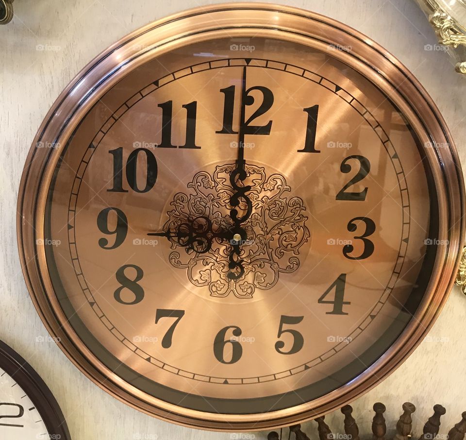 Brown metal wall clock 