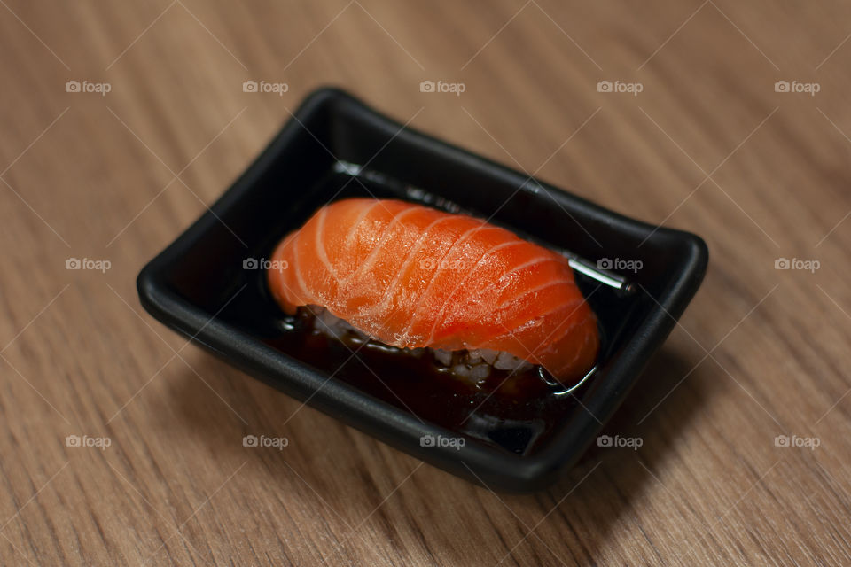 Sushi in soy sauce