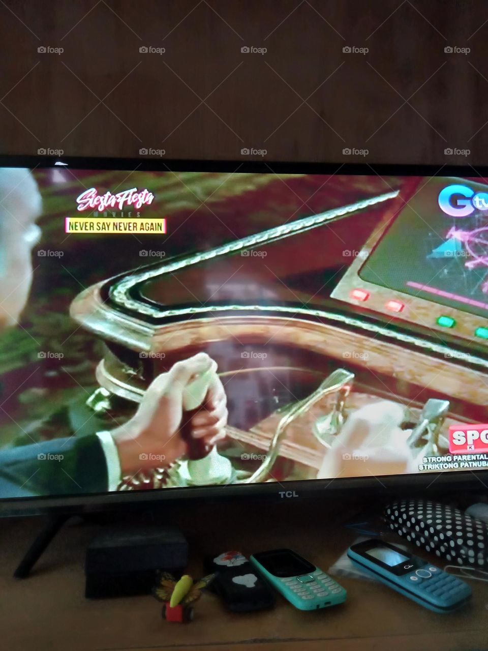 WATCHING MOVIE,, NEVER SAY NEVER AGAIN,, ONE OF THE SCENE,  THE LEADING MAN IS PLAYING VIDEO GAME