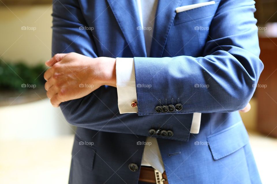Man in suit, crossed arms