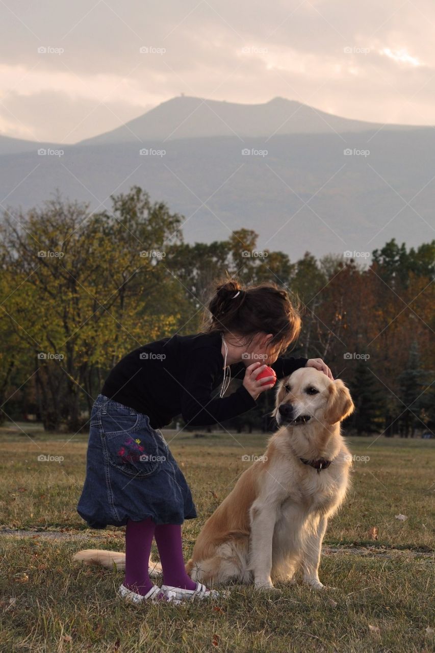 Little girl and pet dog 