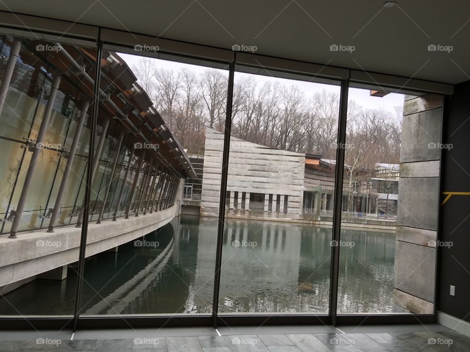 Another view of the outdoors through the windows of crystal bridges museum. Water 